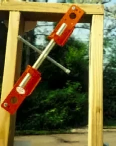 Scroogeclamp set diagonally across a wood frame